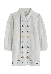 Blusa tipo camisa en tejido ligero a rayas. Presenta patrones florales bordados en azul, negro y amarillo sobre un fondo claro. Mangas abullonadas.