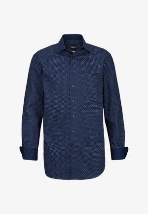 Camicia navy con bottoni, caratterizzata da un piccolo motivo a pois bianchi, maniche lunghe con risvolti e una tasca sul lato sinistro.