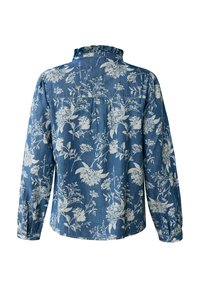 Modrá džínová košile s bílým květinovým vzorem, volánkovým límcem, dlouhými rukávy a knoflíkovými manžetami. Záda mají plisovanou detail pro zvýšení textury.