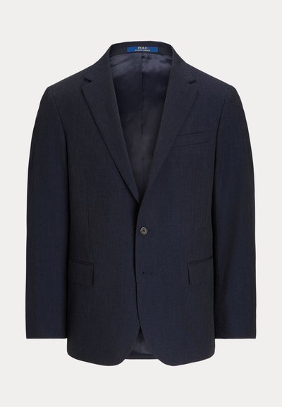 Blazer bleu marine en tissu texturé, avec une fermeture à un bouton, des revers notched et deux poches avant. Intérieur doublé.