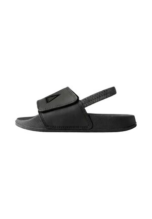 Sandalo nero con punta aperta, cinturino anteriore regolabile e cinturino sul tallone testurizzato, progettato per un uso casual con suola imbottita.