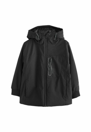 Veste noire avec capuche, fermeture éclair à l'avant et poignets élastiques. Comprend une poche poitrine zippée et un design épuré et minimaliste.