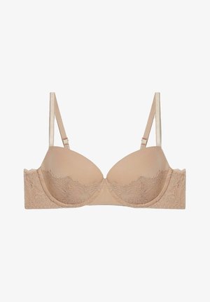 Beige bh met gevoerde cups, kantaccent langs de band, verstelbare schouderbanden en een gladde afwerking. Beschikt over een zachte textuur en subtiele ontwerpdetails.