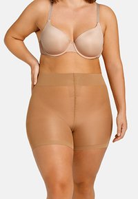 Shorts modellanti a vita alta beige realizzati in materiale liscio ed elasticizzato, dotati di una ampia fascia in vita e design senza cuciture per comfort e supporto.