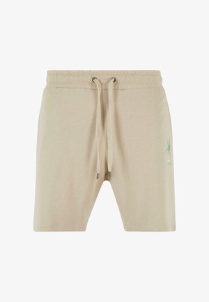 Beige Baumwollshorts mit elastischem Bund und Kordelzug. Mit einem grünen Palmenbaum-Designakzent am linken Bein.