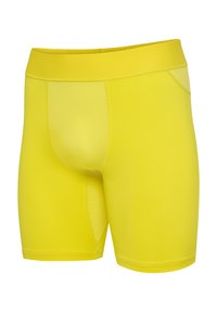 Gele compressie shorts gemaakt van gladde, elastische stof. Voorzien van een brede tailleband en een strakke pasvorm met minimale naden voor comfort.
