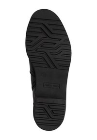 Semelle de chaussure noire avec un design de semelle texturée. Présente le logo "MARCO TOZZI" et la taille "37" en relief sur le côté. Matériau en caoutchouc.