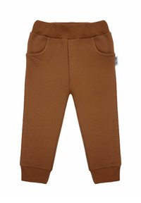 Brązowe bawełniane spodnie dresowe z elastycznym pasem, dwoma bocznymi kieszeniami i ściągaczami przy kostkach. Gładka faktura i luźny krój.