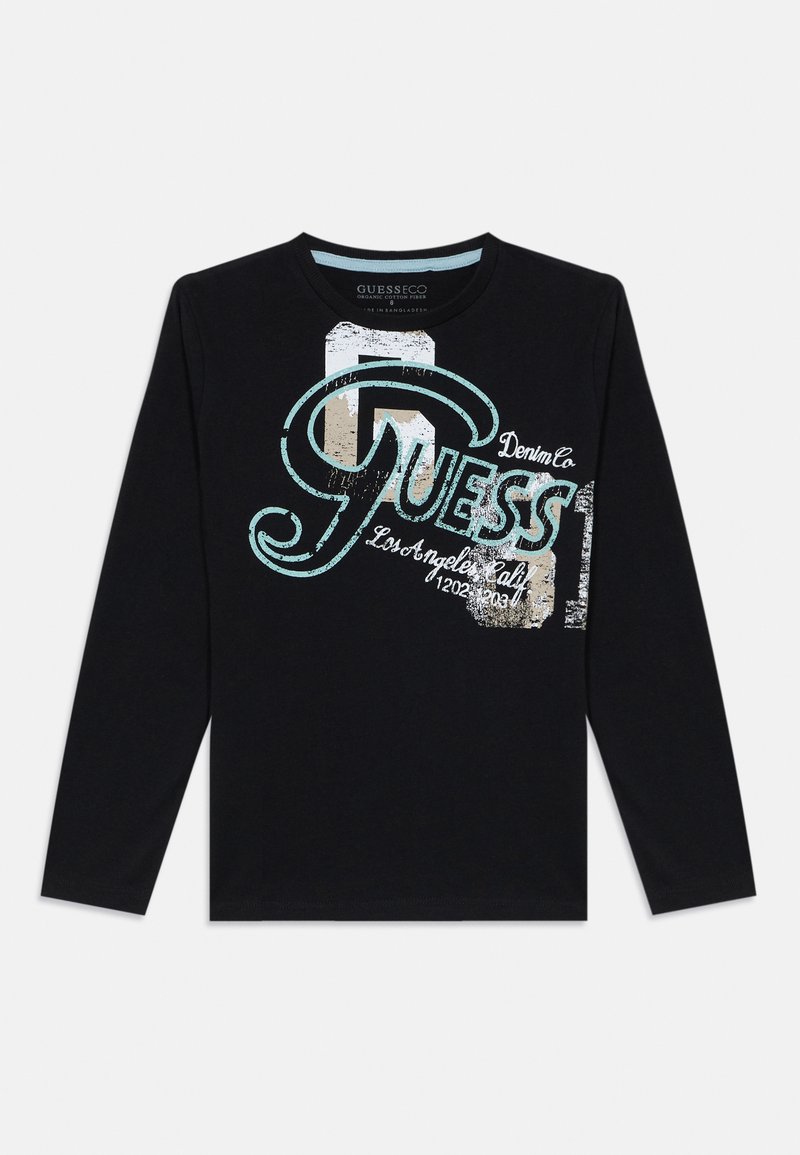 Svart langermet t-skjorte laget av bomull, med et grafisk "GUESS"-logo i blått og hvitt med slitte detaljer.