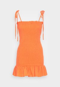 Minidělon v jasně oranžové barvě, s ramenními stuhami, volánkovým lemem a strukturovanou tkaninou. Bez dalších vzorů nebo ozdob.