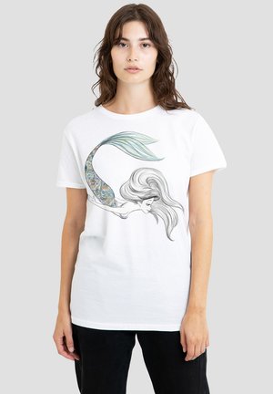 White cotton t-shirt featuring a mermaid graphic with detailed hair and a patterned tail. The design includes blue and green accents.