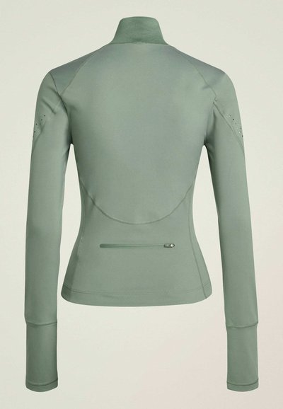 Green athletic jacket with a high collar, long sleeves, and a fitted design. Features smooth fabric, subtle stitching, and a zippered pocket.