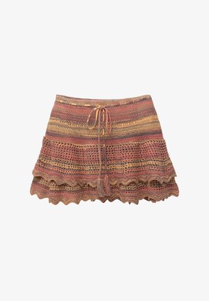 Knit skirt featuring a multi-colored striped pattern in shades of red, yellow, and beige, with a ruffled hem and drawstring waist.