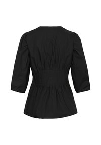Blouse noire à manches longues avec taille cintrée, épaules légèrement bouffantes et bas ample et froncé, vue de dos.