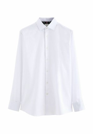 Chemise blanche à manches longues en tissu tissé, avec un col classique, une fermeture à boutons sur le devant et des poignets boutonnés, d'une texture lisse.