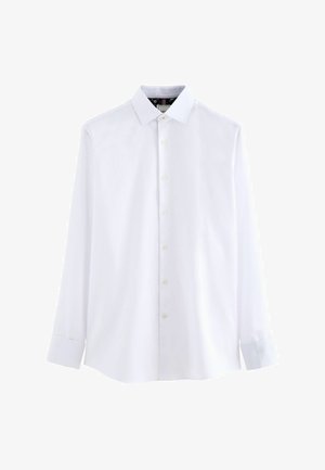 Chemise blanche à manches longues en tissu tissé, avec un col classique, une fermeture à boutons sur le devant et des poignets boutonnés, d'une texture lisse.