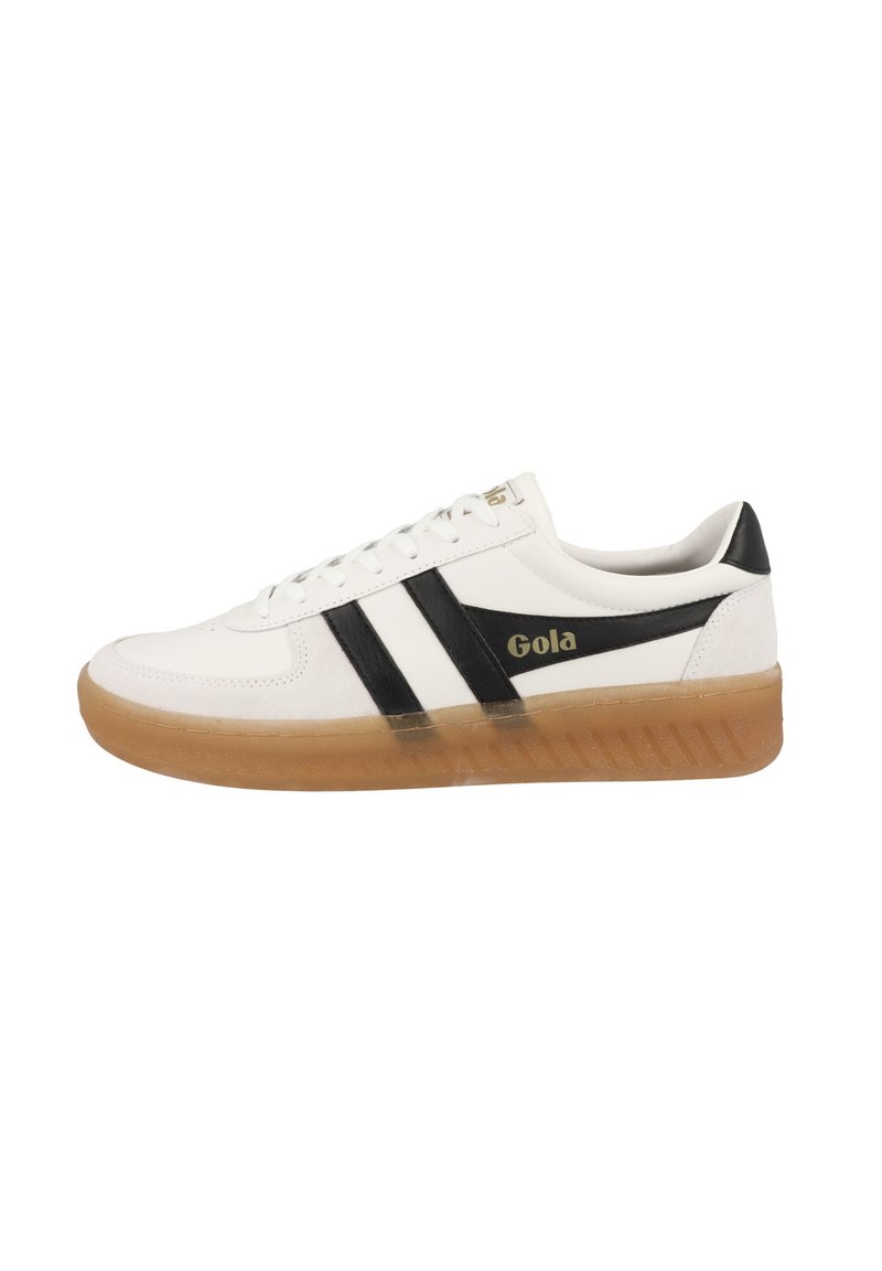Sneaker bianca con strisce nere e logo dorato, dotata di suola in gomma e parte superiore in pelle liscia. Design con lacci, forma della punta rotonda.