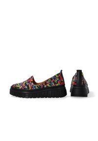 Slip-on shoes with a black base featuring a vibrant, multicolored abstract pattern. Thick, ridged sole adds height and texture.