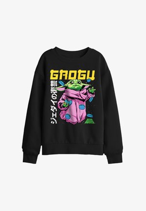 Schwarzer Sweatshirt mit einer bunten Illustration von Grogu in einem pinken Mantel, der blaue Macarons jongliert, mit dem Schriftzug "GROGU" und dem Star Wars Logo.