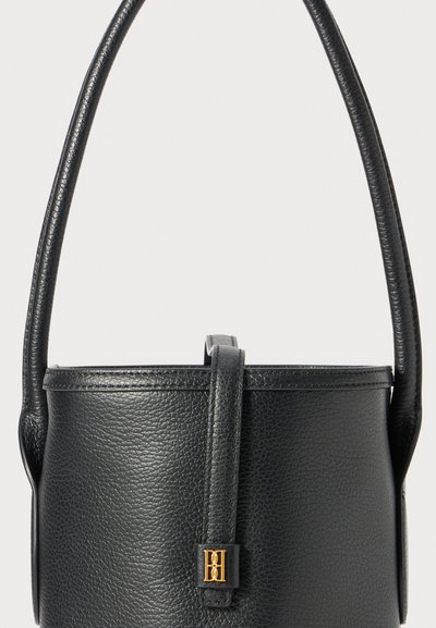 Black leather bucket bag with a textured surface, short handles, and a gold-tone hardware accent featuring an embossed logo.