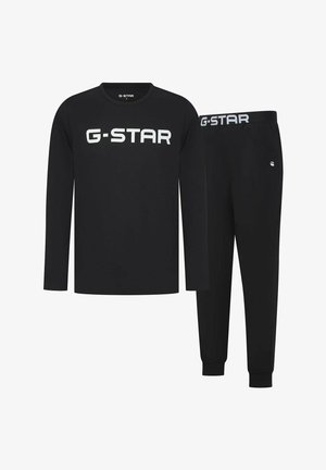 Ensemble de loungewear G-STAR noir comprenant un haut à manches longues avec logo blanc et un pantalon assorti à taille élastique et coupe slim.