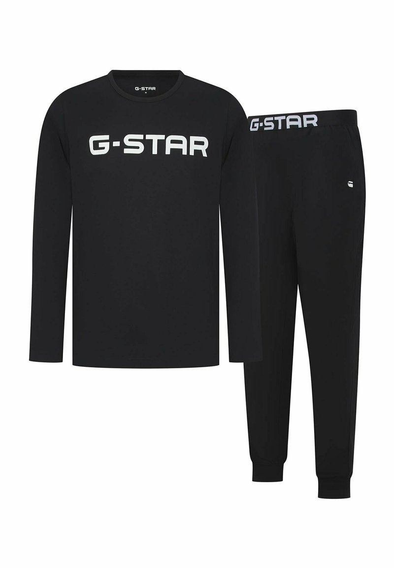Zwarte G-STAR loungewear set met een langemouwen top met wit logo en bijpassende broek met elastische tailleband en slim-fit ontwerp.