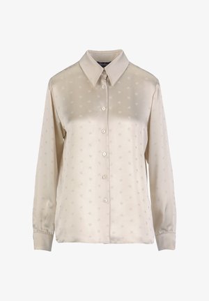 Svetlo bež srajca na gumbke iz satena, z rahlo vtisnjenim vzorcem, dolgimi rokavi in klasičnim ovratnikom.