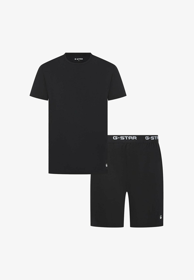 Zwart katoenen t-shirt met korte mouwen en ronde hals, gecombineerd met zwarte katoenen shorts met een elastische tailleband en logo.