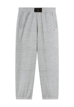 Graue Jogginghosen mit elastischem Bund, Seitentaschen und gerippten Bündchen. Verfügen über einen Logopatch auf der Vorderseite und eine glatte, weiche Textur.