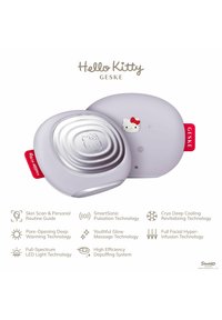 Lilla hudplejeenhed med et sølvtop, prydet med et Hello Kitty design. Rundet form, glat overflade og rød accentetiket.