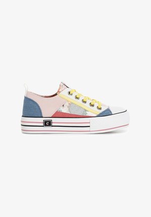 Colorful sneaker featuring mixed materials: pink, blue, and floral patterns. White rubber sole with striped accents. Yellow laces and logo detail.