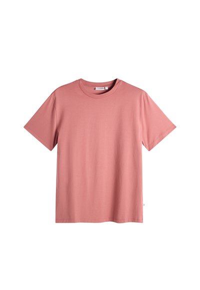 T-shirt rose poudré uni à manches courtes et col rond, présenté sur un fond blanc.