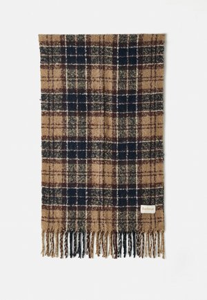 Wool plaid scarf in shades of brown, navy, and green. Finished with fringed edges and a small label at the bottom corner.
