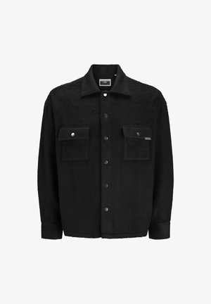 Giacca in pile nera con finitura testurizzata, caratterizzata da due tasche sul petto, chiusure a bottone a pressione e un design del colletto classico.