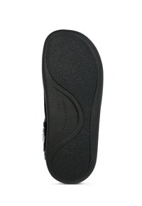 Suola in gomma nera con superficie texture, caratterizzata da un design curvo e un marchio discreto. Leggera e flessibile per il massimo comfort.