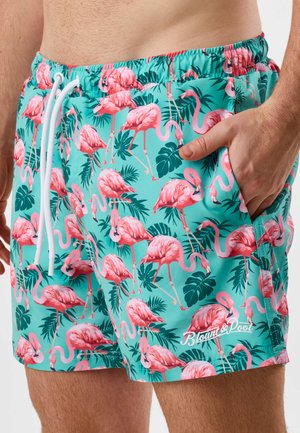 Herrenshorts in Türkis mit pinken Flamingos und grünem tropischem Blattmuster, elastischem Bund, weißem Kordelzug und seitlicher Tasche.