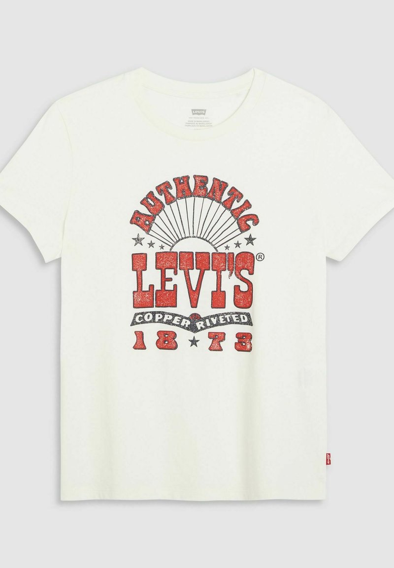 T-shirt blanc à manches courtes avec un design graphique rouge comportant "AUTHENTIC LEVI'S" et "COPPER RIVETED 1873", des étoiles et un motif en forme de rayons de soleil.
