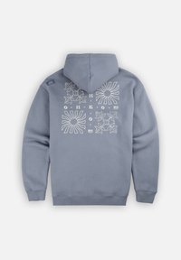 Manteau à capuche gris avec une poche kangourou à l'avant, une capuche et des motifs floraux blancs et des rayons de soleil au dos. Tissu doux en mélange de coton.