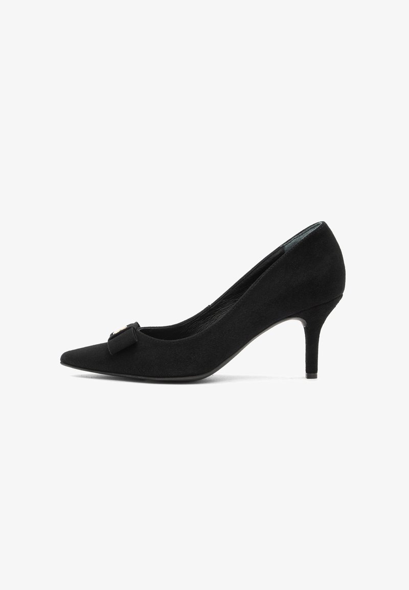 Black suede pointed-toe pump with a kitten heel and decorative bow on the front, shown in side profile on a white background.