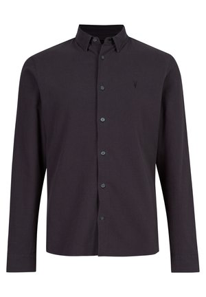 Chemise noire à manches longues avec boutons, col et petit logo brodé sur la poitrine gauche.