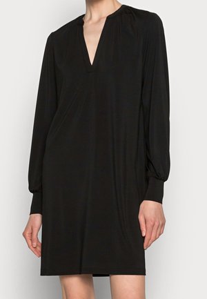 Black long-sleeve dress with a V-neck, featuring gathered detailing at the shoulders and elasticized sleeves, made from smooth, lightweight fabric.