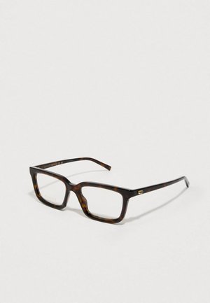Lunettes de vue rectangulaires en écaille de tortue avec des accents dorés. Monture épaisse en plastique, verres transparents et détail de logo subtil sur la branche.