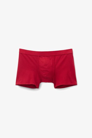 Červené bavlněné šortky na trunky s přiléhavým střihem, s přední kapsou a hladkým pasem, zobrazující minimální švy pro elegantní vzhled.