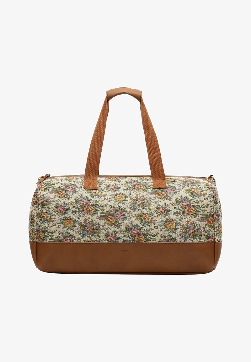 Sac de voyage à motif floral avec une partie supérieure en toile et un fond en cuir brun. Il est doté de deux poignées brunes et d'une fermeture éclair.