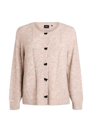 Vaaleanbeige neule, joka on valmistettu pehmeästä materiaalista. Siinä on pyöreä kaula-aukko, pitkät hihat ja mustat ruusukkeet-nappit edessä.