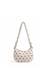 Polka dot skuldertaske i creme og sort. Blødt stof med en rund form og en polstret, struktureret rem for komfort. Har et logo-tag.