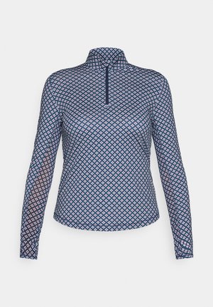 Marineblauwe lange mouw polo van soepel stof met een roze en witte geometrische print, een kwart rits en een rechtopstaande kraag.