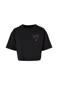 Sort cropped t-shirt lavet af bomuld, med rund halsudskæring og korte ærmer. Frontdesignet inkluderer to skitserede hjerteballoner.