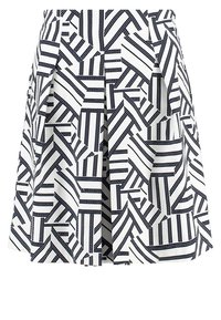 White pleated skirt with black geometric striped pattern arranged in varied directions.