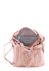 Pink duffel bag with white lettering, made of durable fabric. Features double handles, detachable strap, and a gray interior with a zippered pocket.